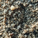 Томруулдаг шилэнд харагдаж буй элс