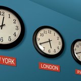 Wall clocks showing different time zones
