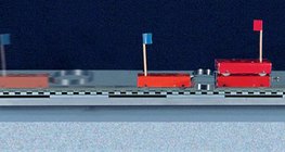 Өөр масстай тэрэгнүүдийг пүршээр холдуулан түлхэх