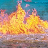 Oil burning on the surface of the seawater