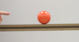 Ball moving initially upwards on an inclined plane